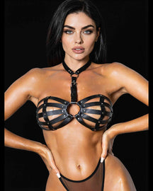 Serena cage harness in black faux leather with choker and centre O-ring, on a model facing the camera, black background