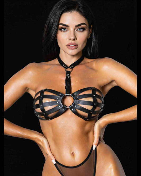 Serena cage harness in black faux leather with choker and centre O-ring, on a model facing the camera, black background
