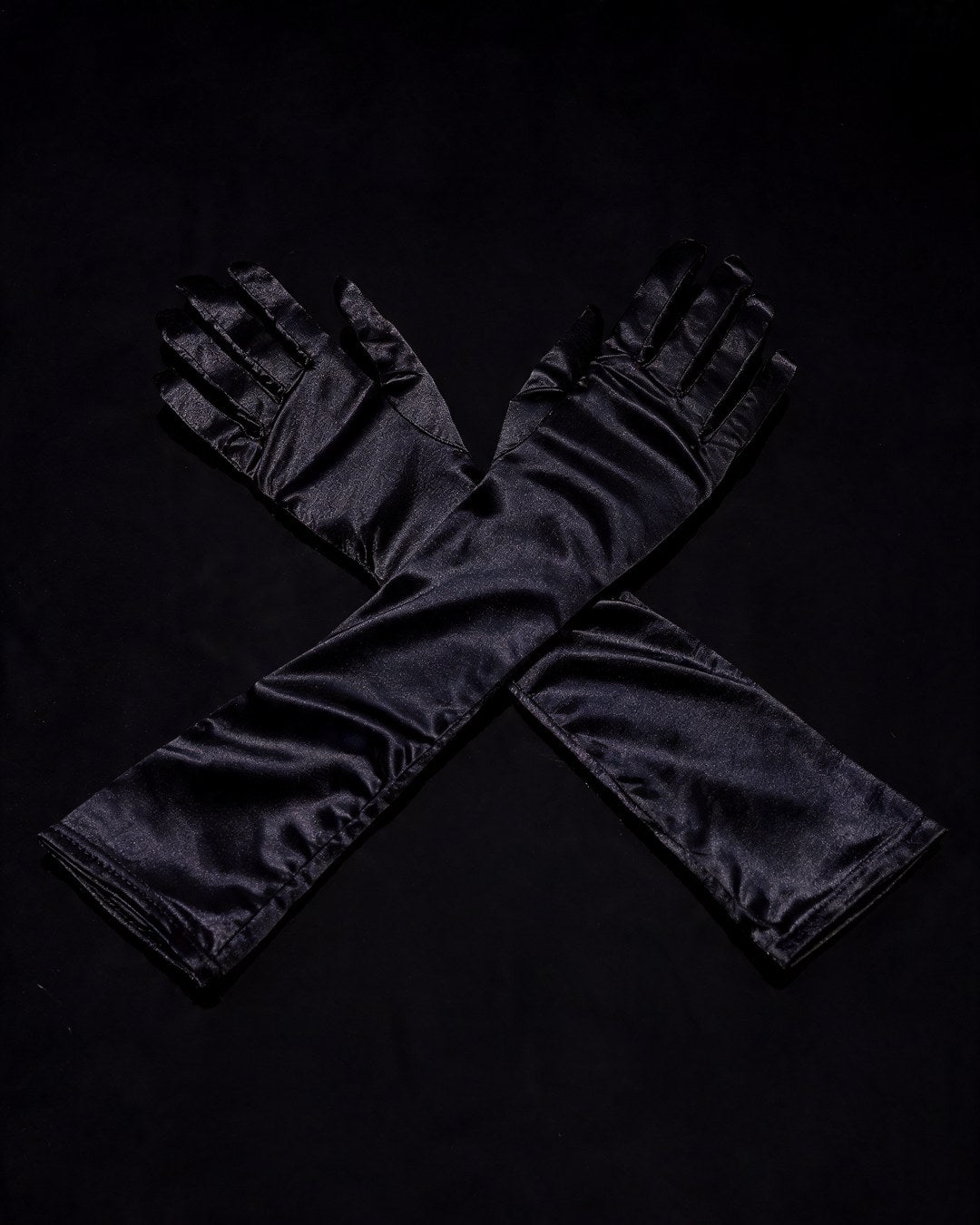 Nikita long black satin opera gloves, black background