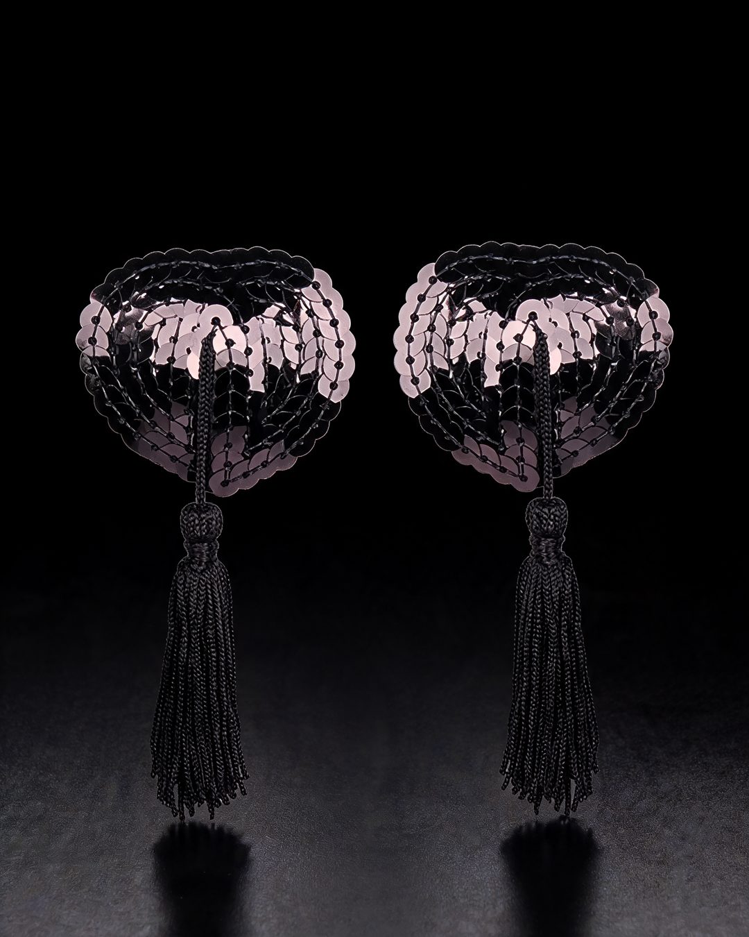 Natasha black sequin heart nipple covers with tassels, black background